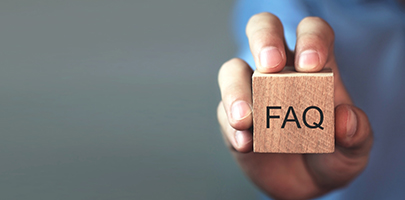 Wooden cube with letters FAQ